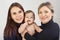 Grandmother, daughter and granddaughter on white portrait