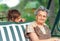 Grandmother with grandchild - senior woman taking and smiling with her granddaughter outdoor