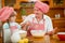 Grandmother and granddaughter baking cookies prepare dough