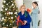 grandmother and granddaughter christmas with flag of united arab emirates at christmas