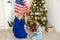 grandmother and granddaughter christmas with usa flag