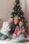 Grandmother and granddaughter decorating a Christmas treeFamily gathered around a Christmas tree, female generations