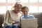 Grandmother and granddaughter have fun shopping online together