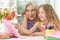 Grandmother and granddaughter learning to use abacus