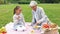 Grandmother and granddaughter at picnic in park