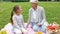 Grandmother and granddaughter at picnic in park