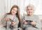 Grandmother with granddaughter playing games