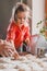 Grandmother and granddaughter sculpt dumplings with meat filling