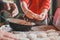 Grandmother and granddaughter sculpt dumplings with meat filling