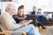 Grandmother And Granddaughter Using Digital Tablet Together