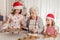 Grandmother with granddaughters baking cookies