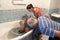 Grandmother and grandfather bathe the child, his grandson. Happy family: grandparents with their grandson. first bathing at home