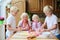 Grandmother with grandkids cooking in the kitchen