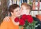 Grandmother and grandson with a bouquet