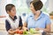 Grandmother And Grandson Preparing meal