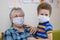 Grandmother and grandson in protective medical masks. Quarantine during the epidemic, protection of the older generation,