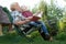 Grandmother and grandson reading a book outdoors.Funny stories.