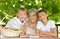 Grandmother and grandsons sitting at table