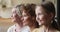 Grandmother, grownup daughter and little granddaughter multi-generational family portrait