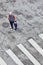 Grandmother guides her grandson on the street, Guangzhou, China