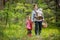 Grandmother and her girls picking mushrooms