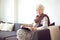 Grandmother at Home Sitting on the Couch