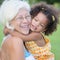 Grandmother hugs her hispanic granddaughter