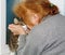 Grandmother kisses the cat