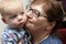 Grandmother kissing her grandson