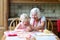 Grandmother making cookies together with granddaughter