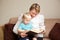 Grandmother or nanny reading to a child