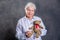 Grandmother with  is puppet doctor for teddy bear