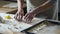 Grandmother putting out star shape cookies on baking pan, traditional recipe