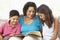 Grandmother Reading With Grandchildren