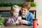 Grandmother retired and granddaughter playing on the phone