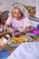 Grandmother Serving Food At Multi-Generation Family Meal At Home