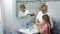 Grandmother teaches a little girl how to wash their hands with soap over a sink with running water.Personal hygiene. Protection