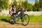 Grandmother teaches little granddaughter to ride bike