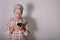 Grandmother using messaging on her mobile phone. technology and communication concept