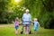 Grandmother with walker playing with two kids