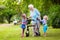 Grandmother with walker playing with two kids