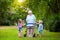 Grandmother with walker playing with two kids