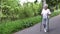 Grandmother walks with Nordic walking sticks old grey