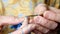 Grandmothers hands crochet green yarn. Closeup clip of senior woman working.