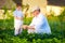 Grandpa explains to curious grandson the nature of plant growth