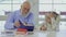 Grandpa with grandson makes school homework together