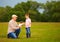 Grandpa presenting little puppy to excited grandson