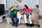 Grandparent And Grandchildren Having Pillow Fight