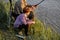 grandparent with grandson fishing together, teaching little young boy to be fisherman