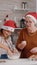 Grandparent helping grandchild preparing homemade traditional cookie dough in culinary kitchen